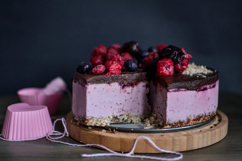 vegan raspberry cream cake with chocolate ganache and berries