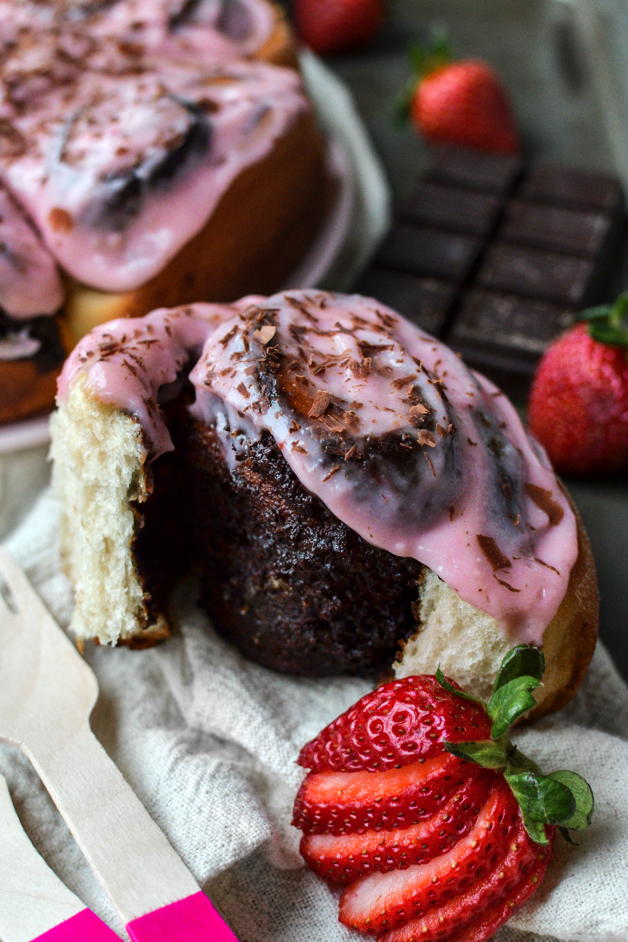 vegan chocolate rolls with strawberry cream cheese frosting