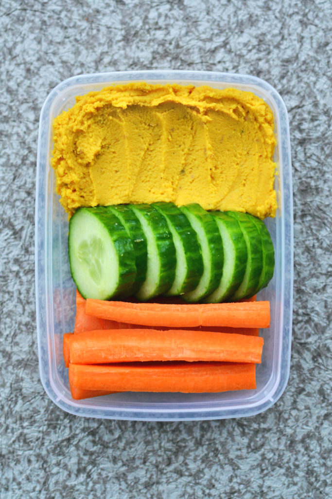 vegan homemade hummus snack box with cucumber carrots