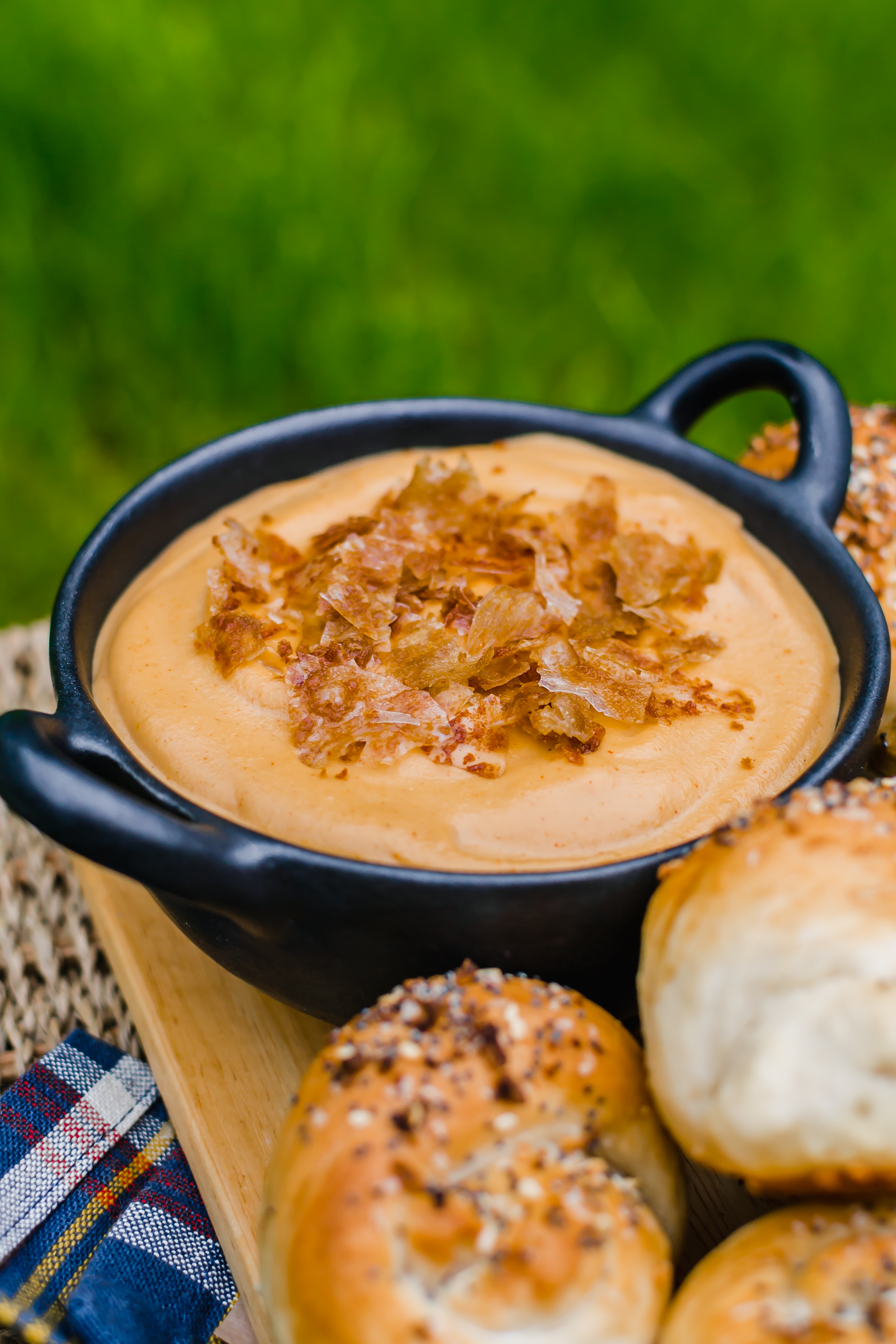 smoky vegan queso dip with rice paper bacon